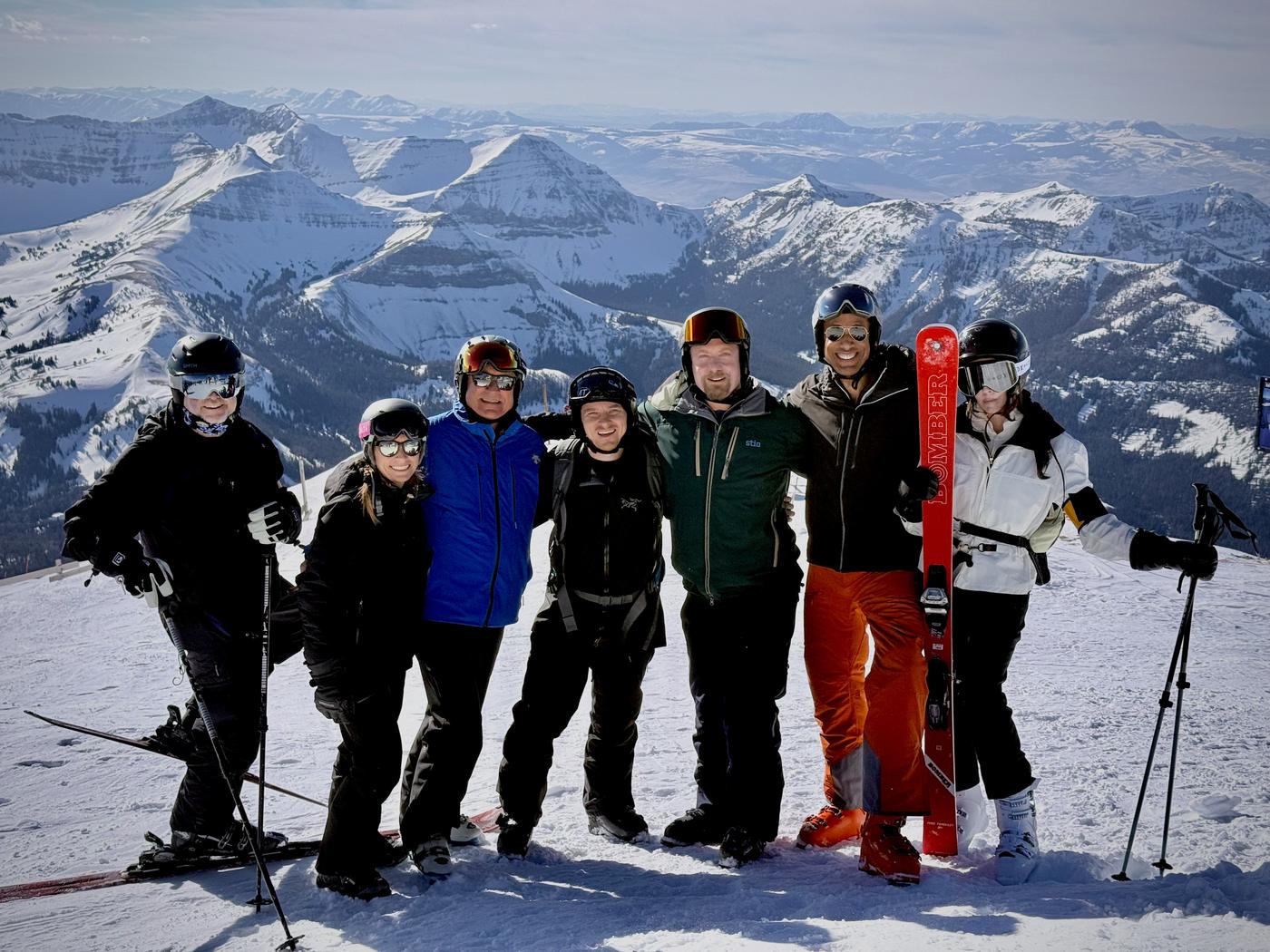Ski Week guests at the summit with the Gallatin Range behind them